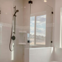 Panorama,built,in,bathtub,with,black,faucet,and,shower,stall