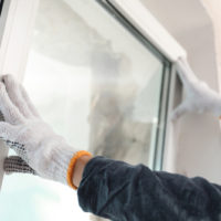 Worker,installing,plastic,window,indoors,,closeup,view